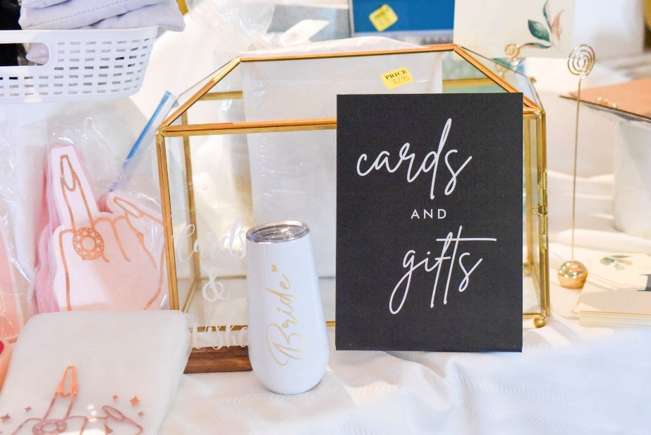 A cards and gifts table display with a glass card box